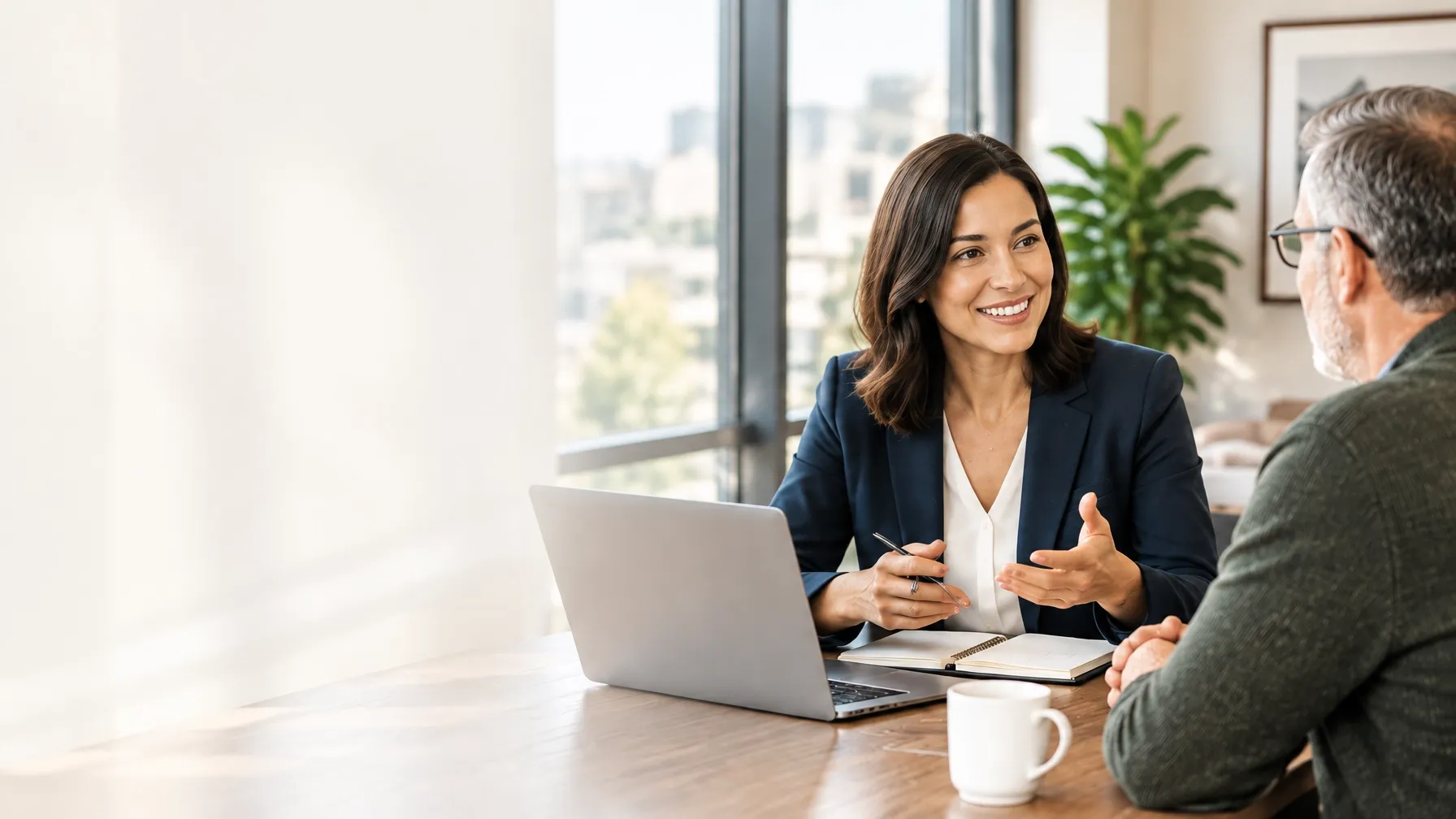 A data consultant speaking with a small-business owner in a bright office